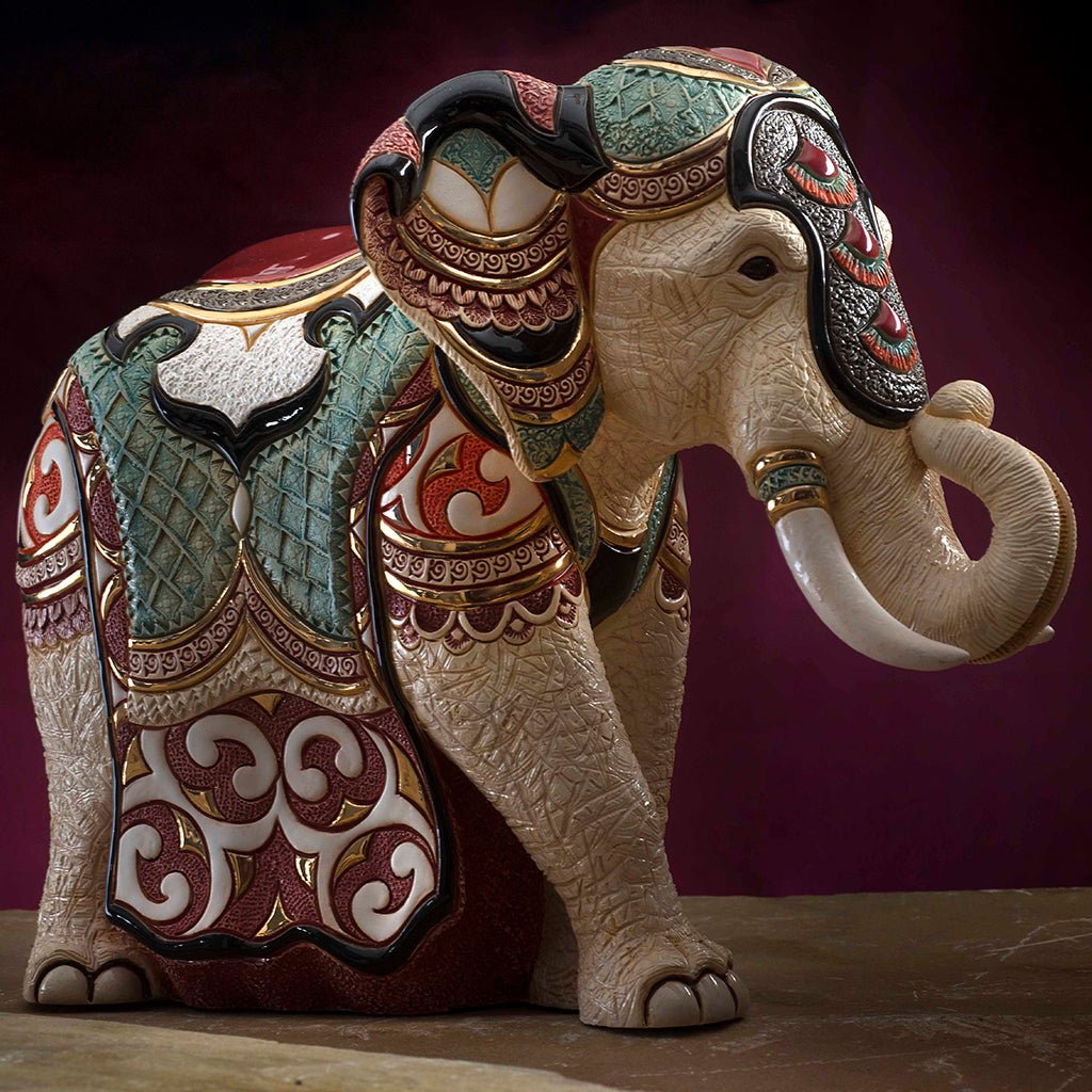 Limited‑Edition Ceramic Elephant Statue. Hand‑Painted Royal Elephant Figurine. Jewel‑Tone Elephant Home Décor Sculpture. Artisan Ceramics Elephantry Ornament. Regal Trunk‑Raised Elephant Artwork. Heritage‑Style Elephant Collectible. Limited Collectible Elephant Sculptural Art.