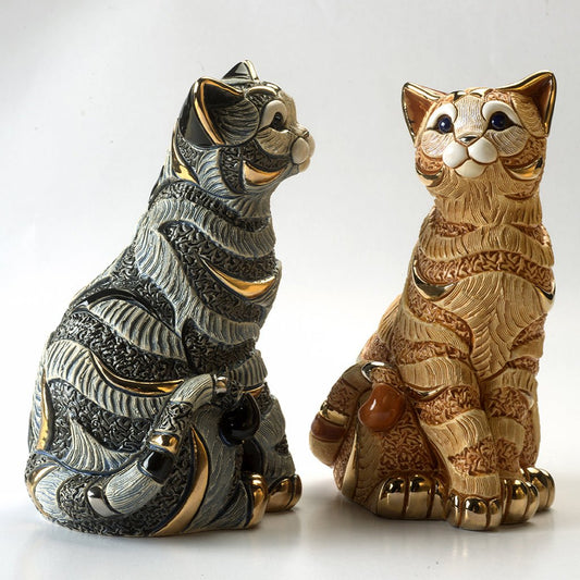 Hand-painted blue and orange tabby cat sculpture with platinum & gold accents. Artisan-crafted Uruguayan collectible figurine symbolizing feline grace and independence.