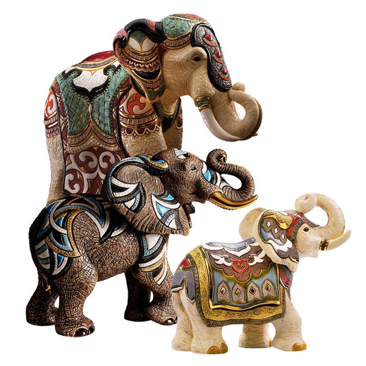 Limited edition elephant figurine set. African and Indian ceramic elephant statues. Decorative elephant sculptures handmade. Artisan elephant trio collectible. Symbolic ceramic elephant figurines. Enamel-painted elephant home décor. Handcrafted elephant sculptures Uruguay. Gold-detailed elephant statues. Feng Shui elephant statues with trunk up. Royal elephant collectible with certificate